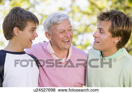 Grandfather with son and grandson smiling. View Large Photo Image Stock Photo - Grandfather with son and grandson smiling.. Fotosearch