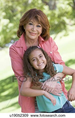 Grandmother and granddaughter smiling View Large Photo Image Stock Photo - Grandmother and granddaughter smiling. Fotosearch