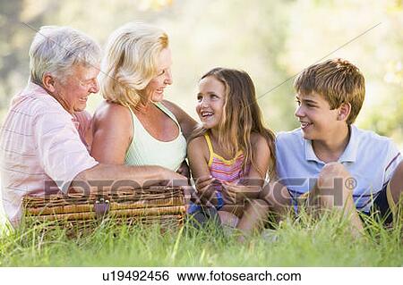 Stock Photograph - Grandparents having a picnic with grandchildren.. Fotosearch
