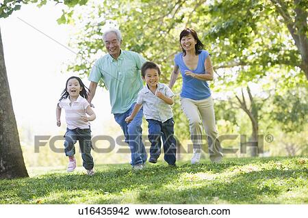 Grandparents running with grandchildren. View Large Photo Image Stock Image - Grandparents running with grandchildren.. Fotosearch