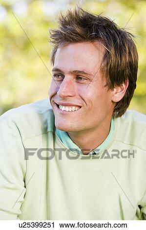 Man outdoors smiling View Large Photo Image Stock Image - Man outdoors smiling. Fotosearch
