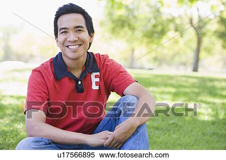 Man sitting outdoors smiling View Large Photo Image Stock Photography - Man sitting outdoors smiling. Fotosearch
