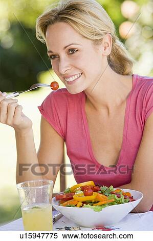 Woman Enjoying A Salad In A Garden View Large Photo Image Stock Photography - Woman Enjoying A Salad In A Garden. Fotosearch
