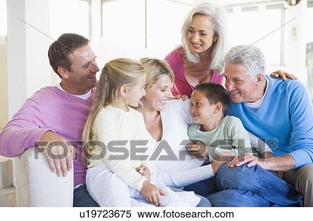 Family sitting indoors smiling View Large Photo Image Stock Photography - Family sitting indoors smiling. Fotosearch