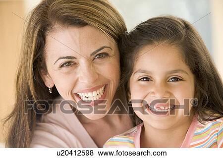 Stock Photo - Woman and young girl smiling. Fotosearch