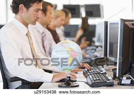 Five businesspeople in office space with a desk globe in foreground View Large Photo Image Stock Photo - Five businesspeople in office space with a desk globe in foreground. Fotosearch