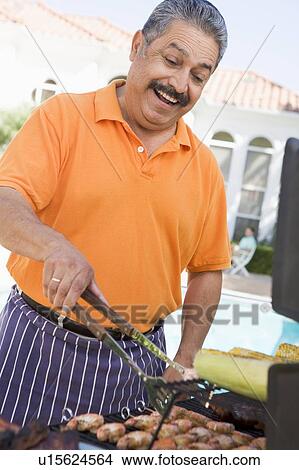 Man Barbequing In A Garden View Large Photo Image Picture - Man Barbequing In A Garden. Fotosearch