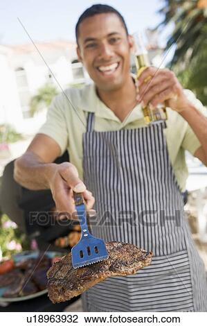 Man Barbequing In A Garden View Large Photo Image Stock Image - Man Barbequing In A Garden. Fotosearch