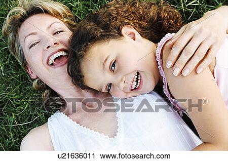 Mother and daughter outdoors smiling View Large Photo Image Stock Image - Mother and daughter outdoors smiling. Fotosearch