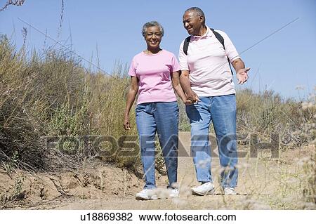 Senior couple on a walking trail View Large Photo Image Stock Image - Senior couple on a walking trail. Fotosearch