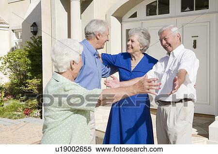 Two senior couples greeting each other with open arms View Large Photo Image Stock Photography - Two senior couples greeting each other with open arms. Fotosearch