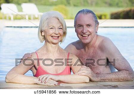 Couple in outdoor pool smiling View Large Photo Image Stock Photograph - Couple in outdoor pool smiling. Fotosearch
