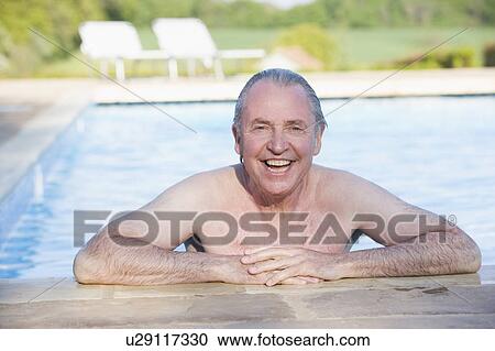 Man in outdoor pool smiling View Large Photo Image Stock Image - Man in outdoor pool smiling. Fotosearch