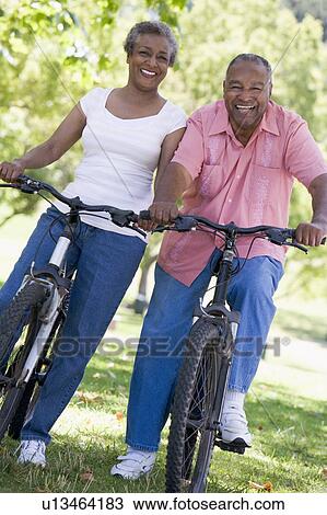 Senior couple on bicycles View Large Photo Image Stock Image - Senior couple on bicycles. Fotosearch