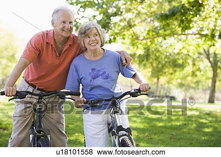 Stock Photo - Senior couple on bicycles. Fotosearch