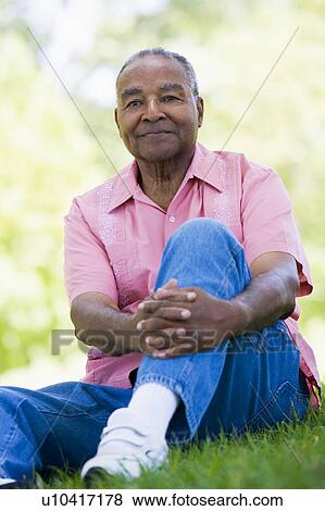 Senior man sitting outdoors View Large Photo Image Stock Photo - Senior man sitting outdoors. Fotosearch