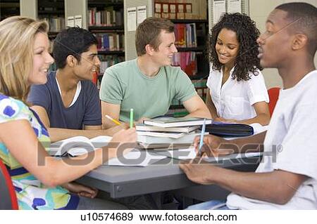 Stock Photo - Five people in library studying (selective focus). Fotosearch