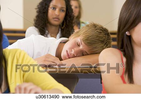 Student in class sleeping (selective focus) View Large Photo Image Stock Image - Student in class sleeping (selective focus). Fotosearch