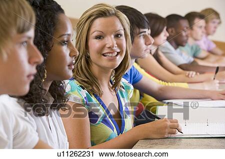 Students in class paying attention and taking notes (selective focus) View Large Photo Image Stock Image - Students in class paying attention and taking notes (selective focus). Fotosearch