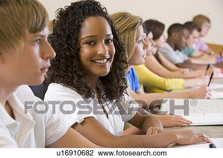 Students in class paying attention and taking notes (selective focus) View Large Photo Image Stock Image - Students in class paying attention and taking notes (selective focus). Fotosearch
