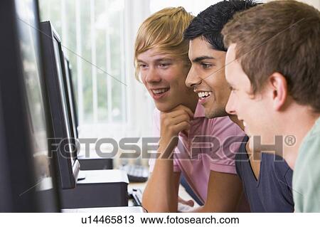 Three men sitting at a computer terminal (high key) View Large Photo Image Stock Image - Three men sitting at a computer terminal (high key). Fotosearch