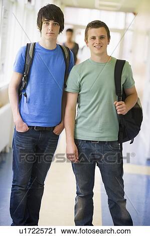 Two students standing in corridor (selective focus) View Large Photo Image Stock Image - Two students standing in corridor (selective focus). Fotosearch