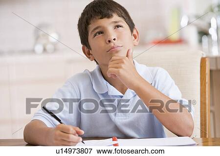 Stock Photo - Boy Doing His Homework. Fotosearch