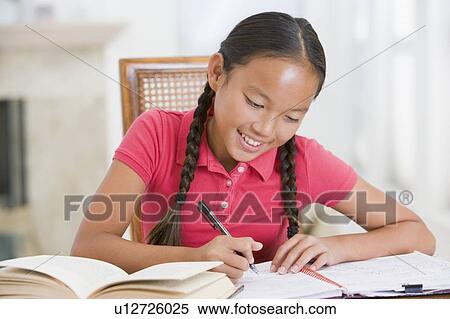 Stock Photography - Girl Doing Her Homework. Fotosearch
