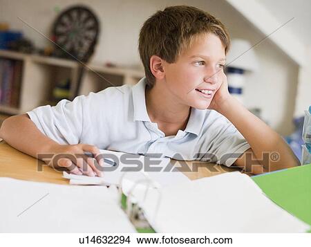 Young Boy Doing Homework In His Room View Large Photo Image Picture - Young Boy Doing Homework In His Room. Fotosearch