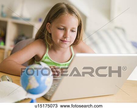 Young Girl Doing Homework On A Laptop View Large Photo Image Stock Image - Young Girl Doing Homework On A Laptop. Fotosearch