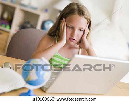 Young Girl Doing Homework On A Laptop View Large Photo Image Stock Photograph - Young Girl Doing Homework On A Laptop. Fotosearch