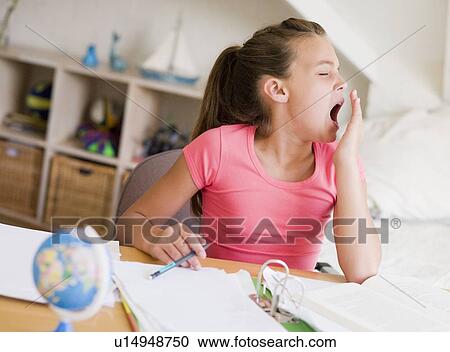 Young Girl Yawning, Doing Her Homework View Large Photo Image Stock Image - Young Girl Yawning, Doing Her Homework. Fotosearch