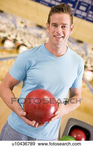 Stock Photo - Man at a bowling lane. Fotosearch