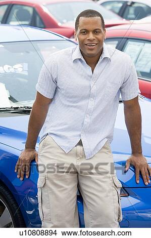 Picture - Man shopping for a new car. Fotosearch