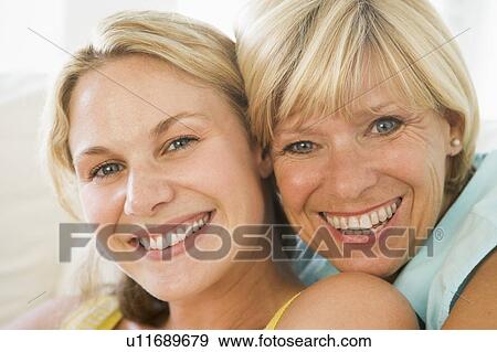 Mother and grown up daughter smiling View Large Photo Image Stock Photo - Mother and grown up daughter smiling. Fotosearch