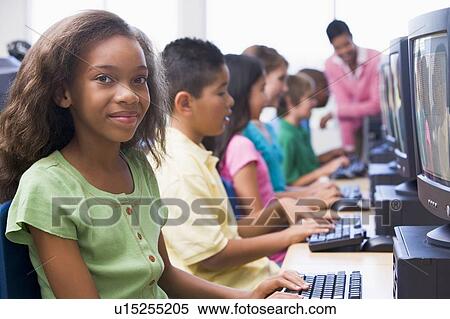 Six children at computer terminals with teacher in background (depth of field/high key) View Large Photo Image Stock Photography - Six children at computer terminals with teacher in background (depth of field/high key). Fotosearch
