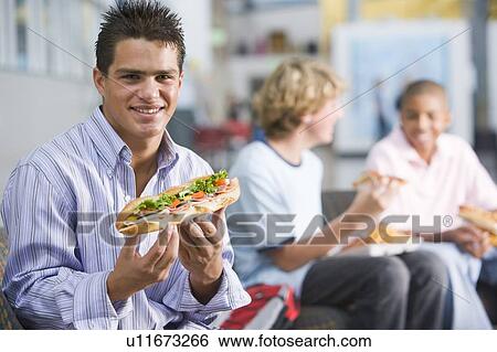 Students having lunch View Large Photo Image Stock Photograph - Students having lunch. Fotosearch
