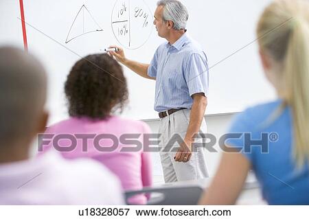 Students in math class with teacher View Large Photo Image Stock Photo - Students in math class with teacher. Fotosearch