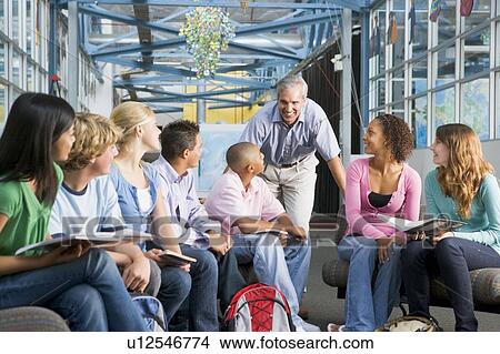 Picture - Students study group with teacher. Fotosearch