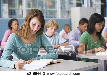 Stock Image - Students studying in geography class. Fotosearch