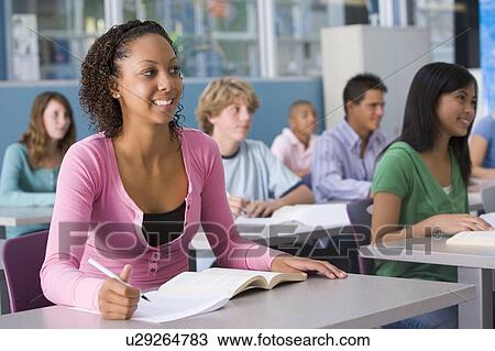 Stock Image - Students studying in geography class. Fotosearch