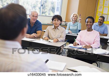 Adult students in class with teacher (selective focus) View Large Photo Image Stock Photography - Adult students in class with teacher (selective focus). Fotosearch