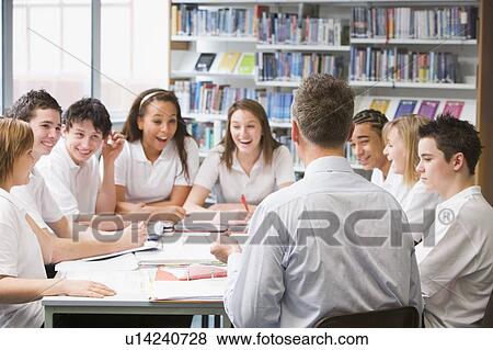 Students and teacher in a study group collaborating View Large Photo Image Stock Photo - Students and teacher in a study group collaborating. Fotosearch