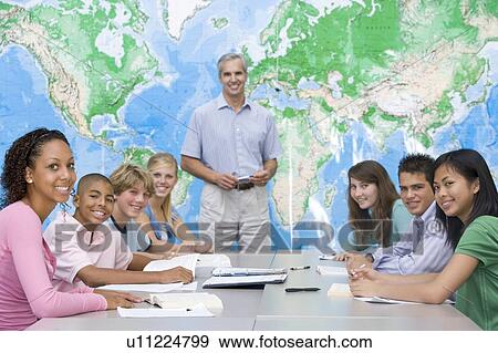 Stock Photo - Students answering questions in geography class. Fotosearch