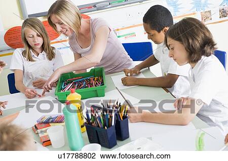 Students in art class with teacher View Large Photo Image Stock Image - Students in art class with teacher. Fotosearch