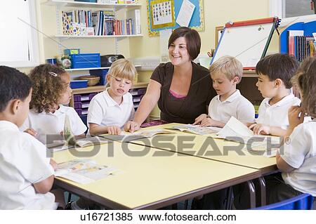 Students in class with teacher reading View Large Photo Image Stock Photography - Students in class with teacher reading. Fotosearch
