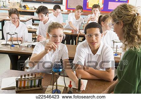 Students performing science experiments in classroom View Large Photo Image Stock Image - Students performing science experiments in classroom. Fotosearch