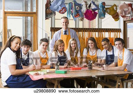 Stock Image - Students receiving art lessons. Fotosearch