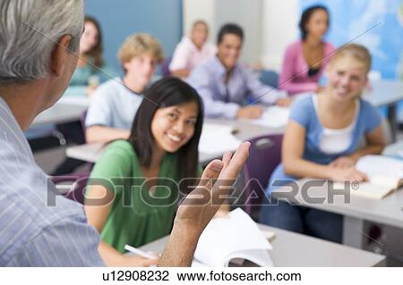 Students studying in geography class with teacher View Large Photo Image Stock Image - Students studying in geography class with teacher. Fotosearch