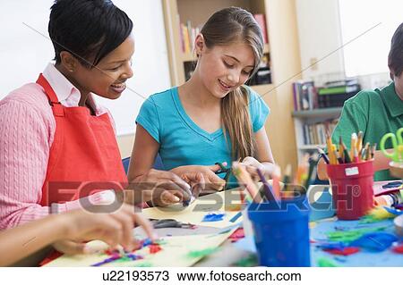 Teacher and student in art class (selective focus) View Large Photo Image Stock Image - Teacher and student in art class (selective focus). Fotosearch